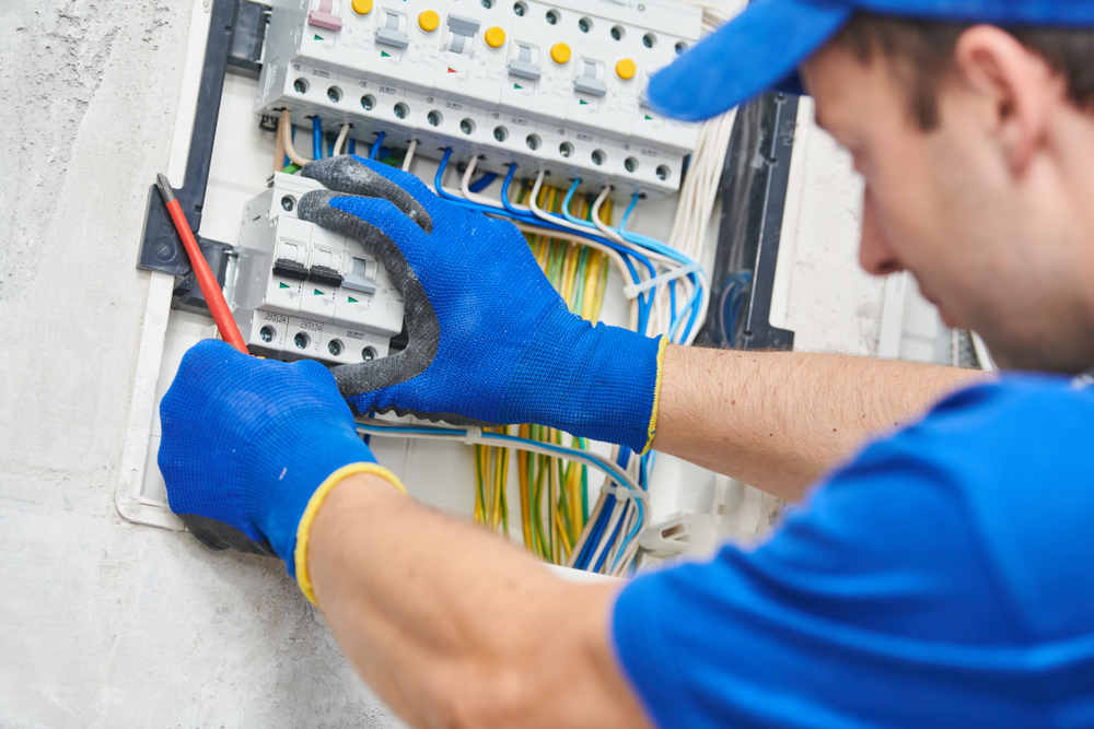 electrician installing safety switch | electrician campbelltown | Unified Electrical